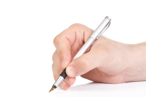 Hand Holding a Pen | Dr. Lisa Bunin | Allentown